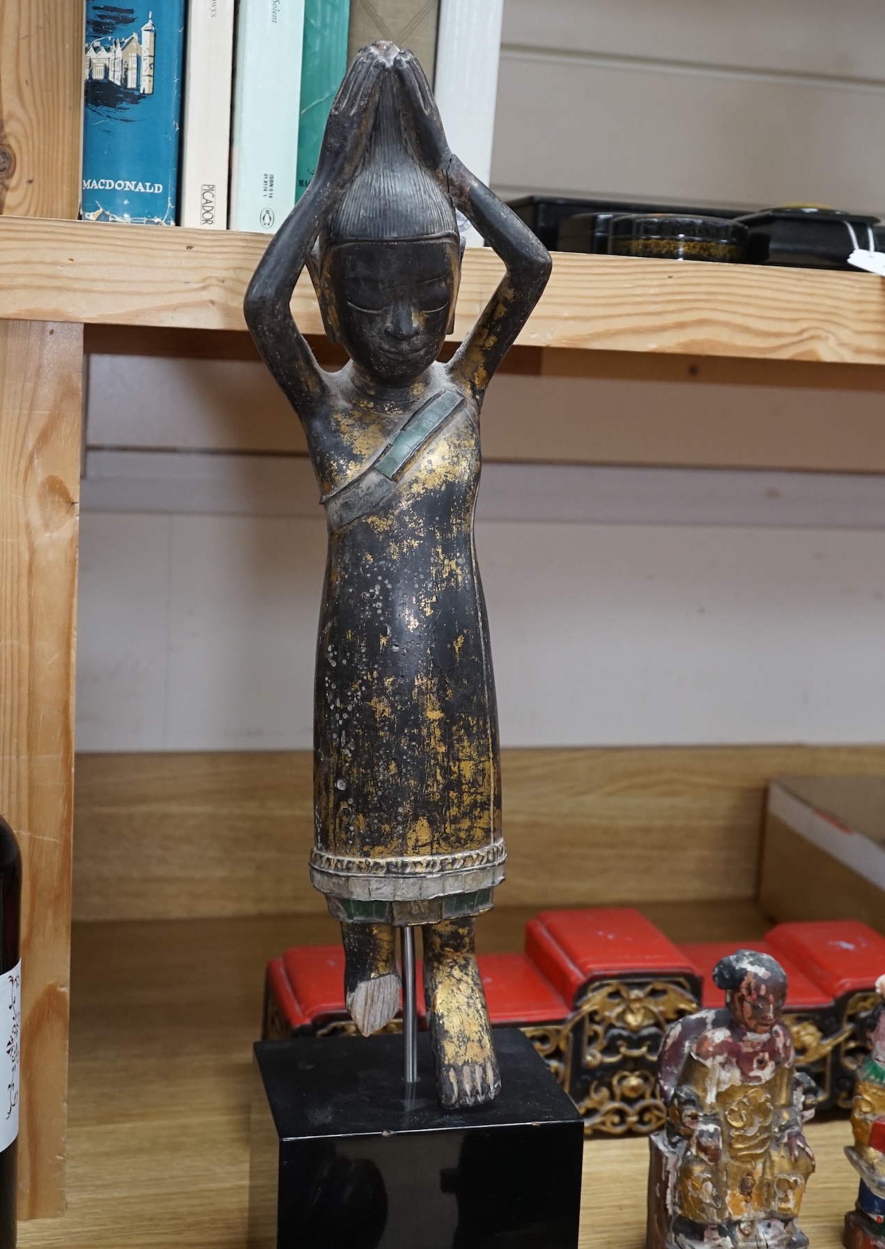 A carved painted South East Asian figure on stand, lacquered wood figures and carvings and a carved frog box, painted figure 50cm high. Condition - mixed, poor to fair